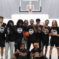 Students wearing championship shirts from a men's basketball tournament